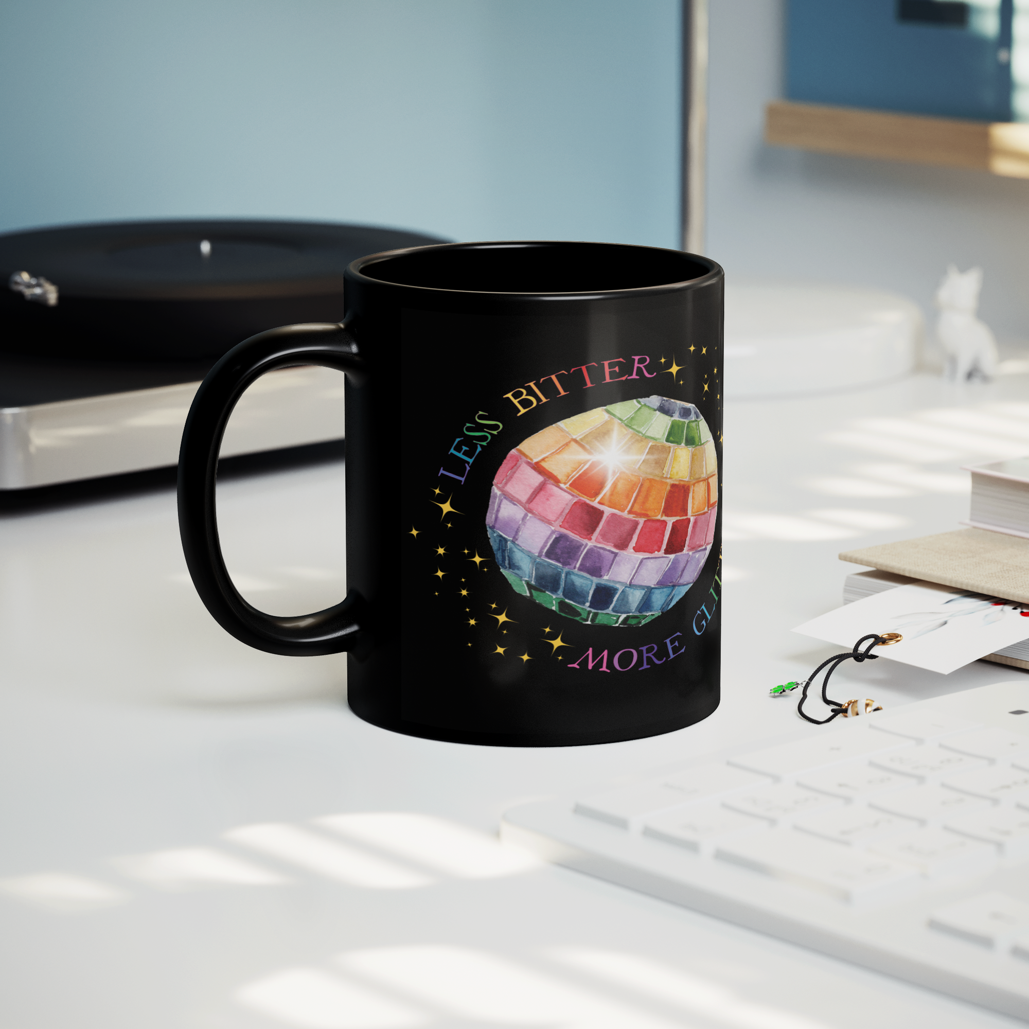 Less_Bitter_More_Glitter_Black_11oz_Mug_Lifestyle_Record_Player_Mockup.png