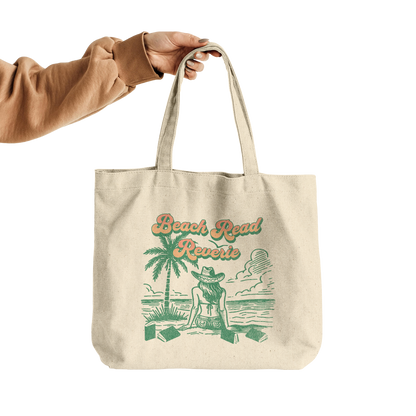 Beach_Read_Reverie_Canvas_Tote_CottonTote_L_HandTransparent_Mockup.png