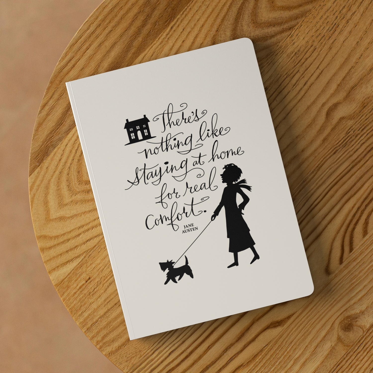 Home_is_Comfort_-_Jane_Austen_Softcover__Lifestyle_2_Mockup.png