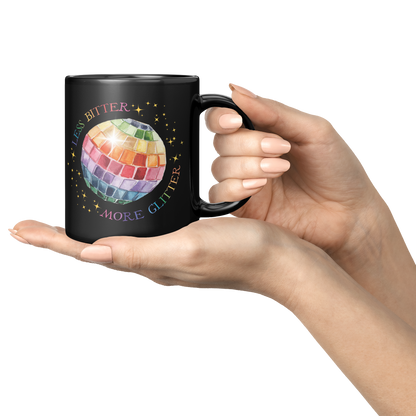 Less_Bitter_More_Glitter_Black_11oz_Mug_Lifestyle_Presentation_Hands_Mockup.png