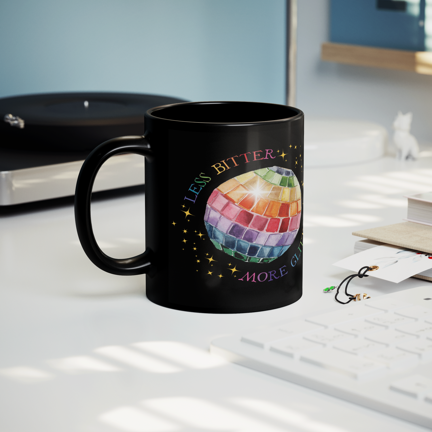 Less_Bitter_More_Glitter_Black_11oz_Mug_Lifestyle_Record_Player_Mockup.png