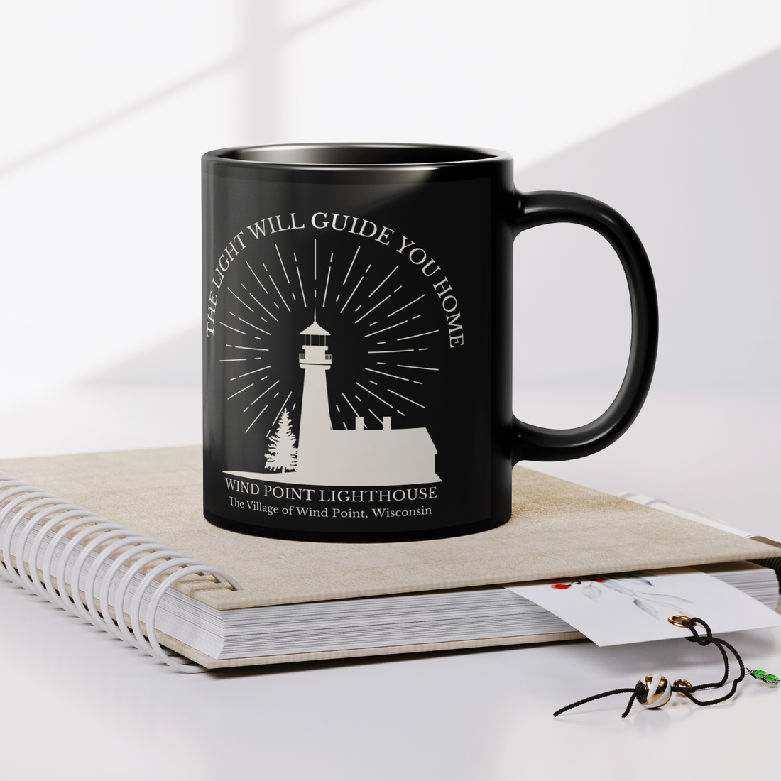 Wind_Point_Lighthouse_Black_Mug_Lifestyle_Notebook_Mockup.png